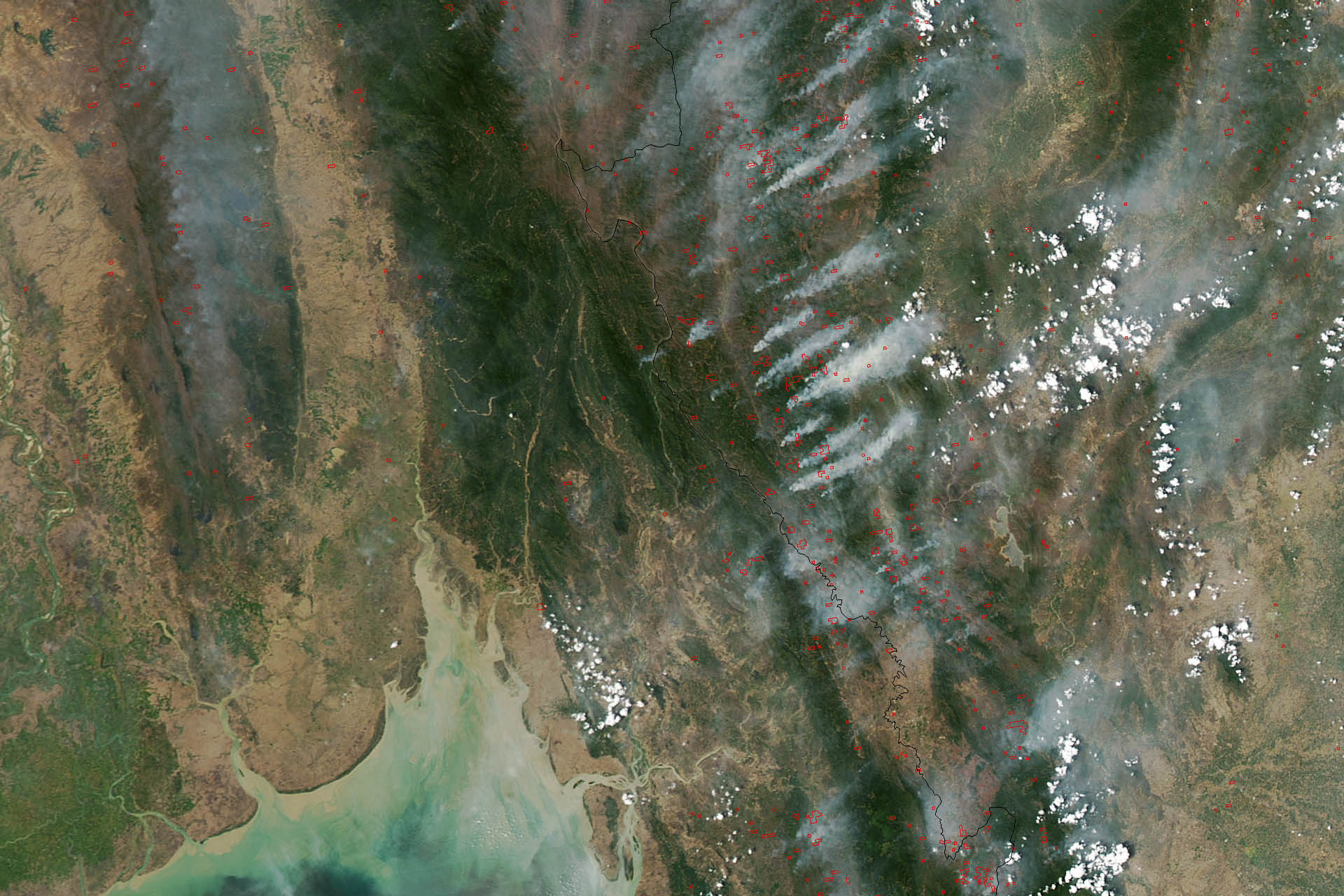 This image of fires burning throughout Burma (Myanmar) and Thailand was acquired on March 22, 2013, by the Moderate Resolution Imaging Spectroradiometer (MODIS) on NASA’s Aqua satellite. MODIS detects fires not from visible smoke plumes, but from thermal infrared energy radiating from the land surface. The heat is invisible in images like this, but the locations where MODIS detected fires are labeled with red dots. (Source: NASA)